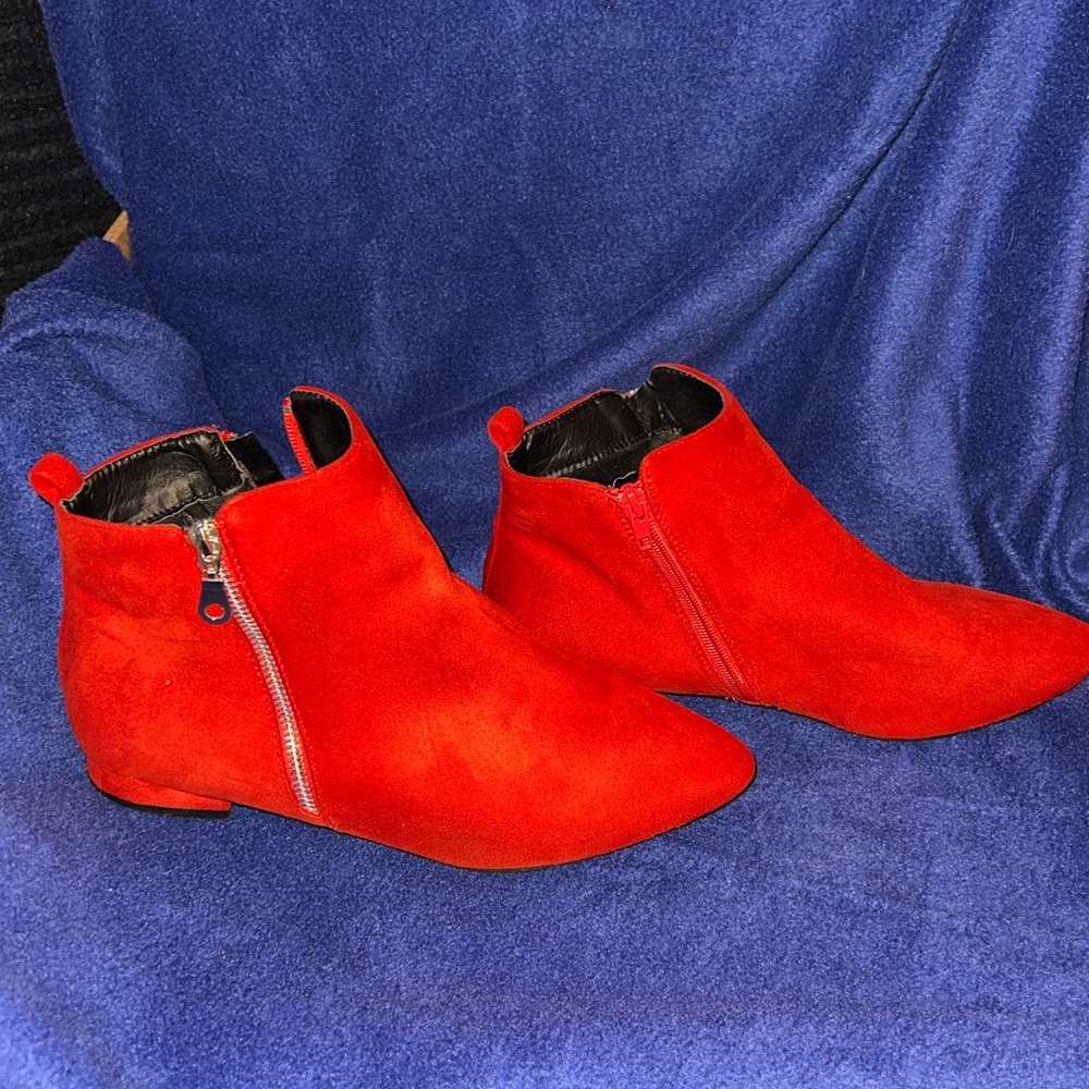 Red suede booties with offset zippers. Worn once.